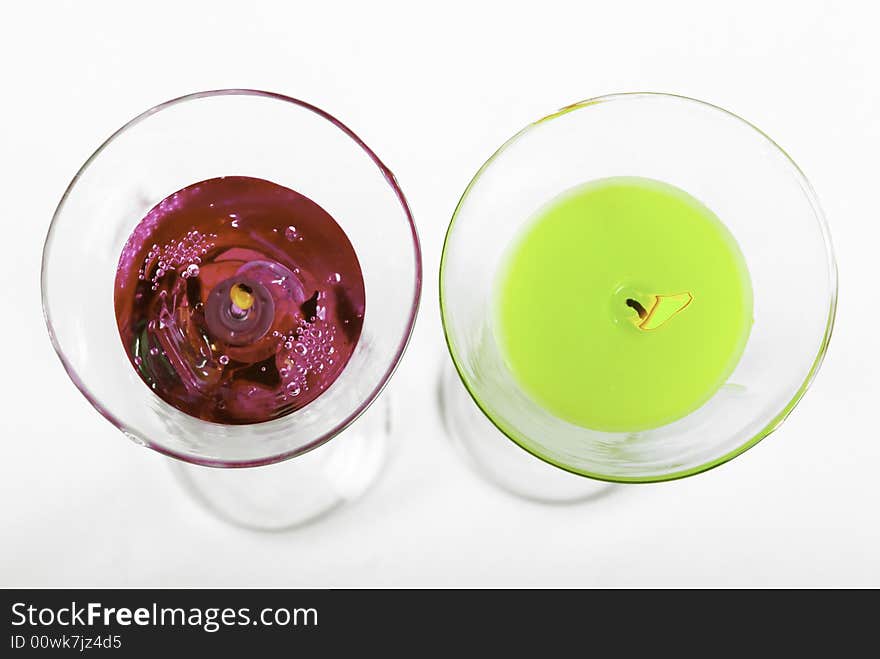 Red and green candles on the black background