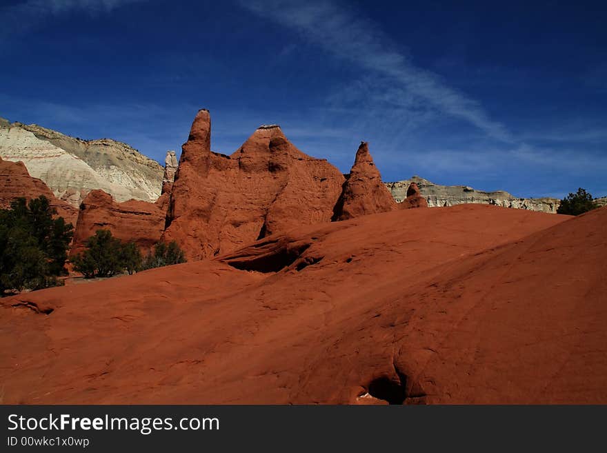 View of the red rock formations in Kodachrome Basin with blue skys and clouds. View of the red rock formations in Kodachrome Basin with blue skys and clouds