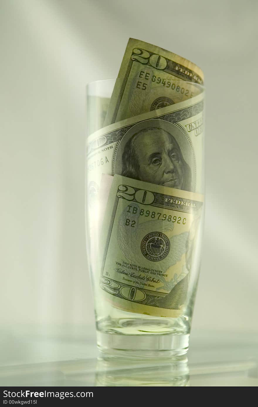 Dollars in glass, metaphor of luxury and success