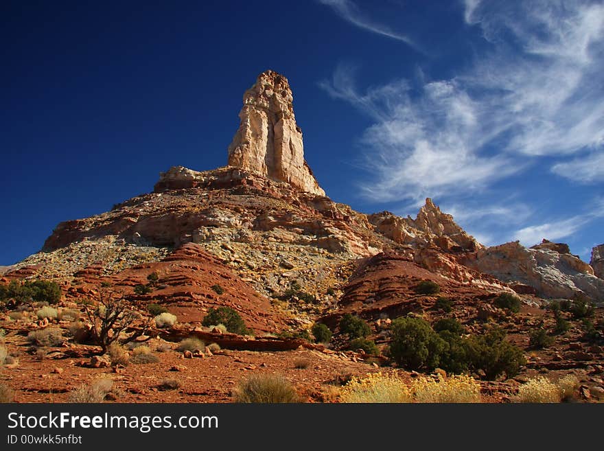 View of the red rock formations in San Rafael Swell with blue sky�s and clouds. View of the red rock formations in San Rafael Swell with blue sky�s and clouds