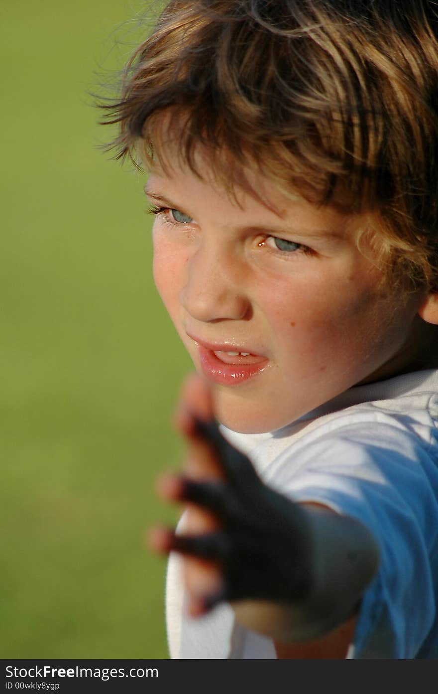 Close-up outdoor portrait of boy at park. Close-up outdoor portrait of boy at park