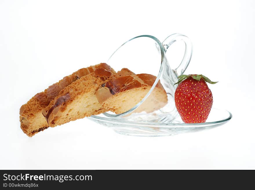 Biscotti in coffee cup with strawberry. Biscotti in coffee cup with strawberry