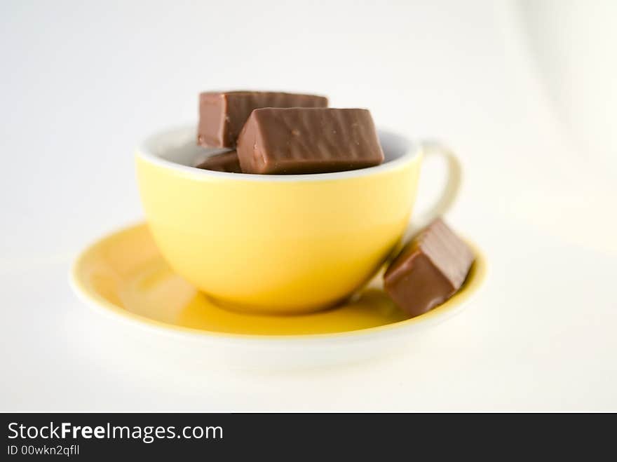 Chocolade Candies In Yellow Cup, Hot Chocolate