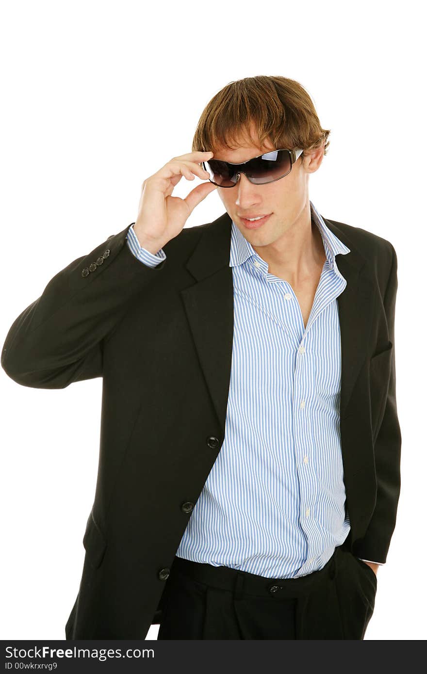 Handsome young businessman removing his sunglasses.  Isolated on white. Handsome young businessman removing his sunglasses.  Isolated on white.