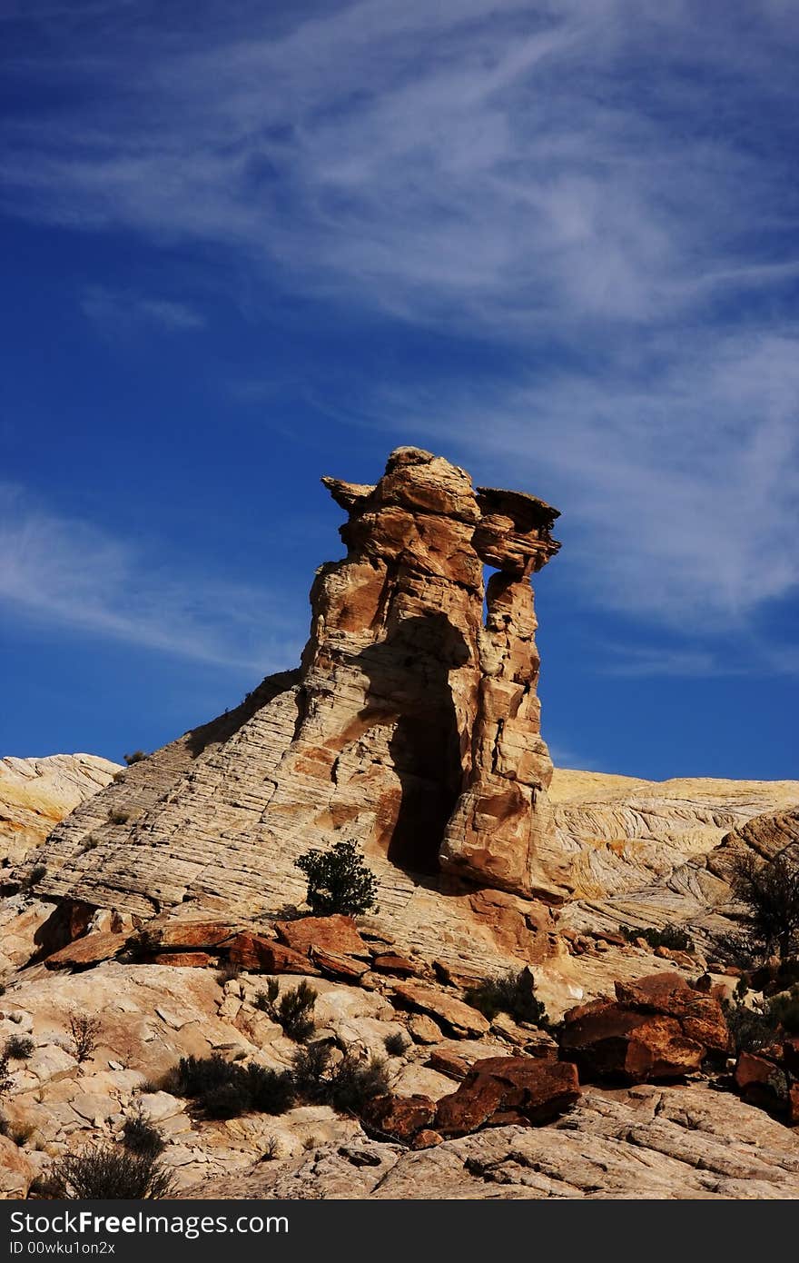 View of the red rock formations in San Rafael Swell with blue sky�s and clouds. View of the red rock formations in San Rafael Swell with blue sky�s and clouds