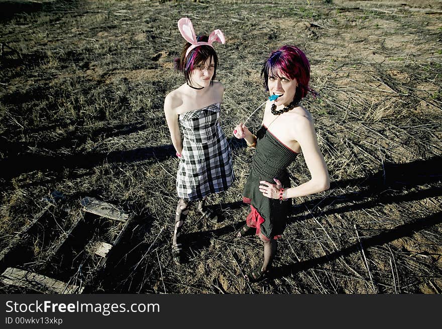 Two punk girls posing in a rural setting. Two punk girls posing in a rural setting