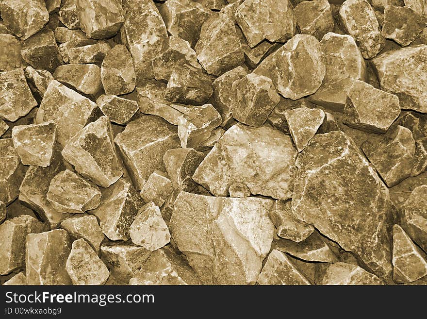 Rugged sepia rock wall background