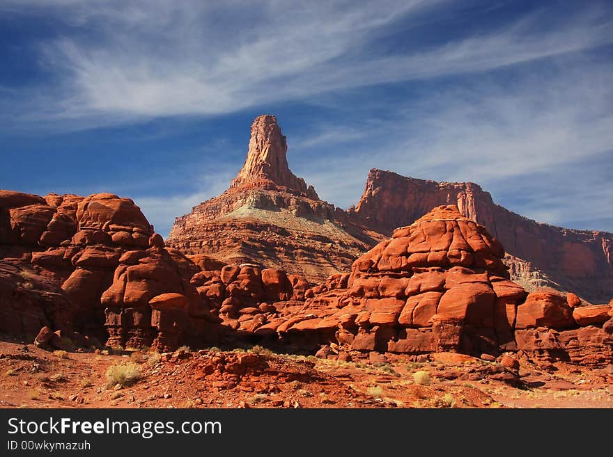 View of the red rock formations in Canyonlands National Park with blue sky�s and clouds. View of the red rock formations in Canyonlands National Park with blue sky�s and clouds