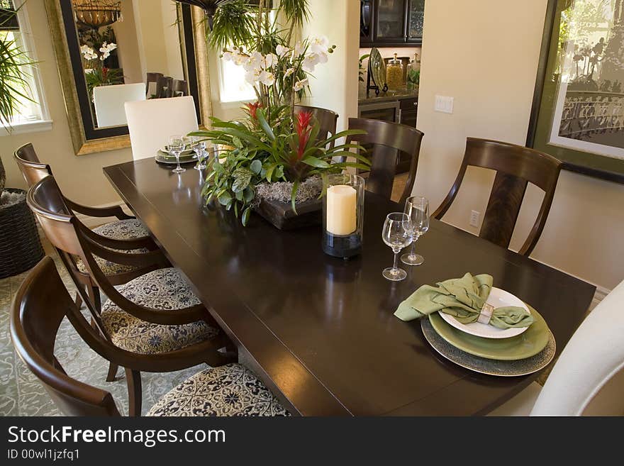 Luxury home dining table with modern tableware. Luxury home dining table with modern tableware.