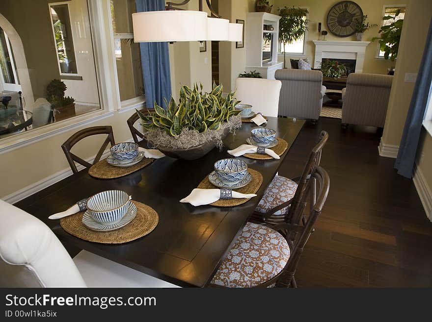 Luxury home dining table with modern tableware. Luxury home dining table with modern tableware.