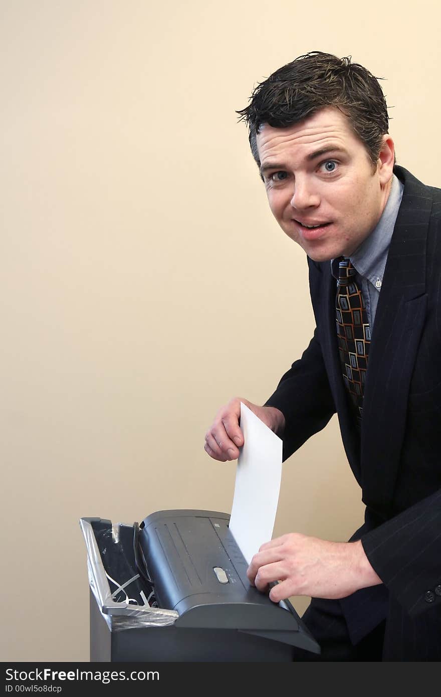 Businessman Shredding Documents