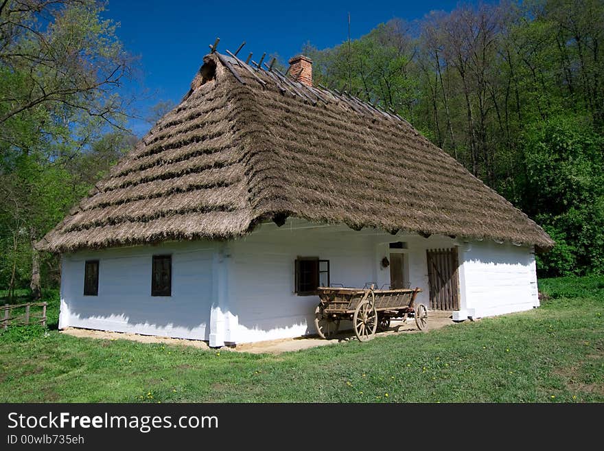 Very old Polish white hut with thatched roof. Very old Polish white hut with thatched roof