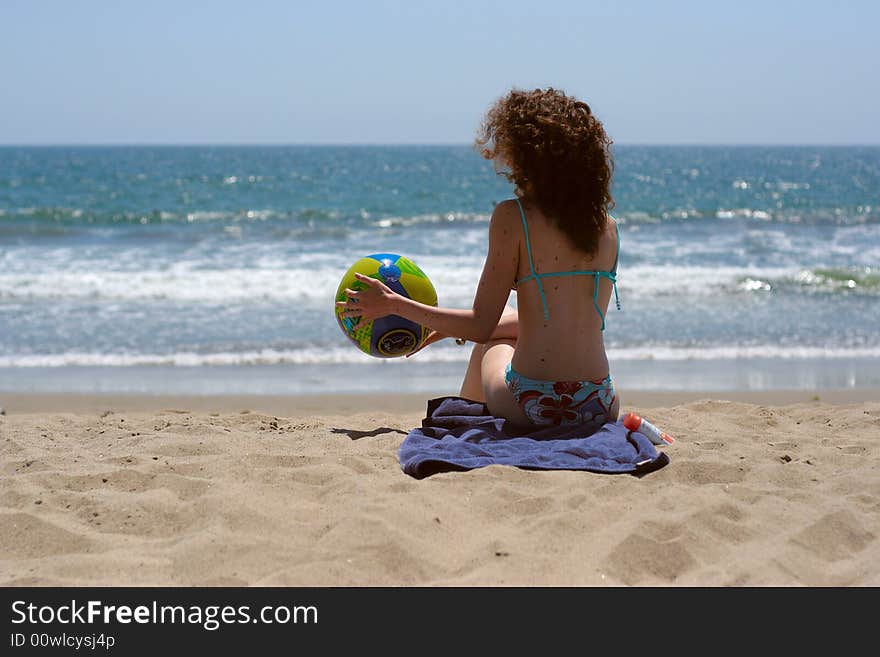 Young beautiful lady on the beach