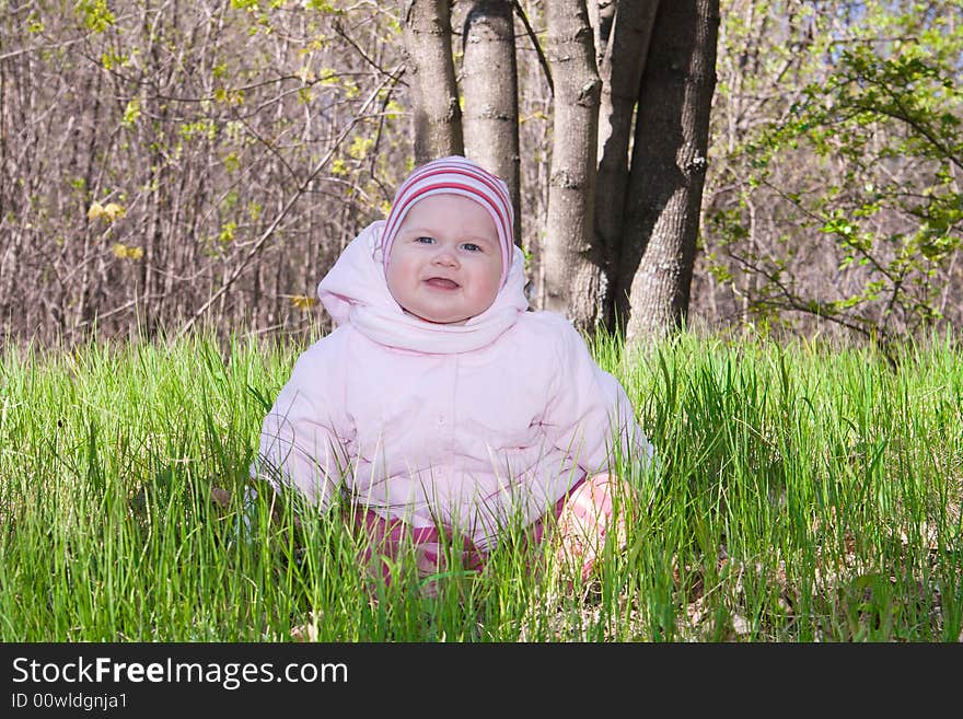 Smiling Baby On Green Grass