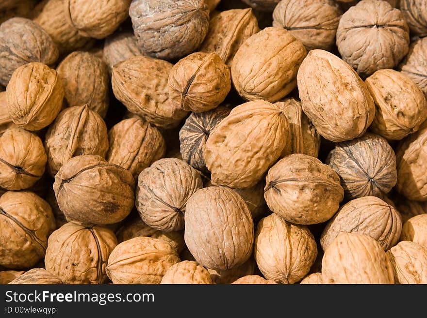 Walnuts background at the market