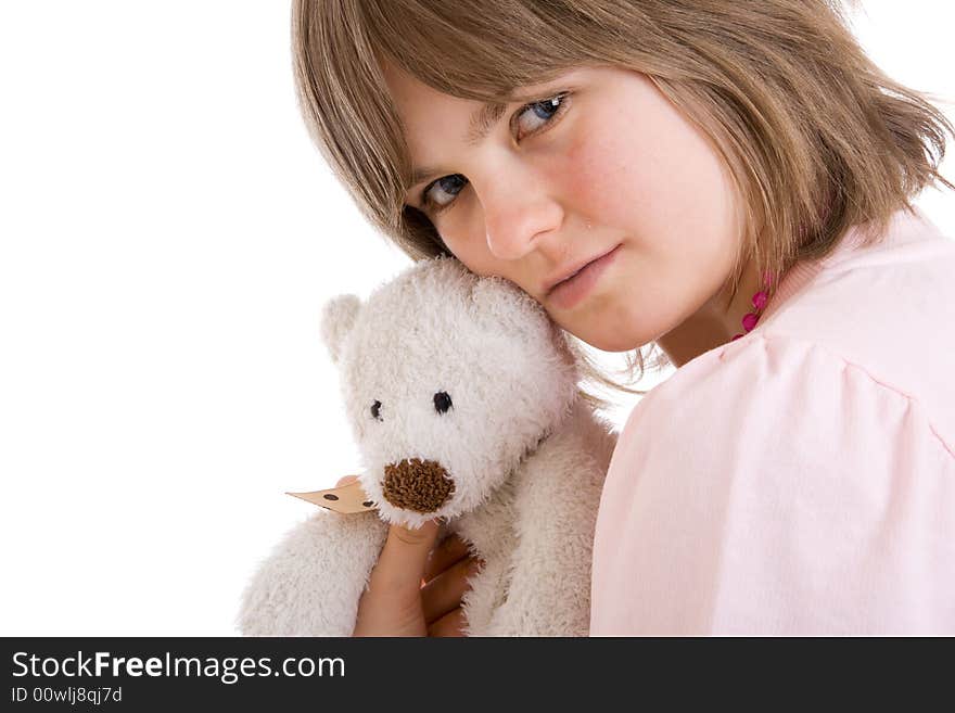 The young girl with a teddy bear isolated on a white background