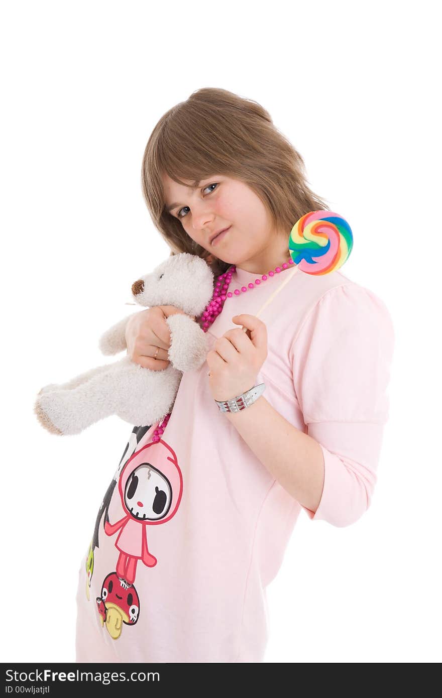 The girl with a sugar candy and teddy isolated on a white background