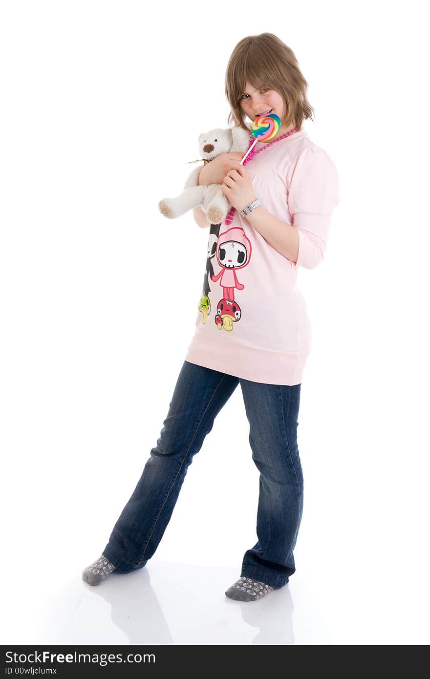 The girl with a sugar candy and teddy isolated on a white background