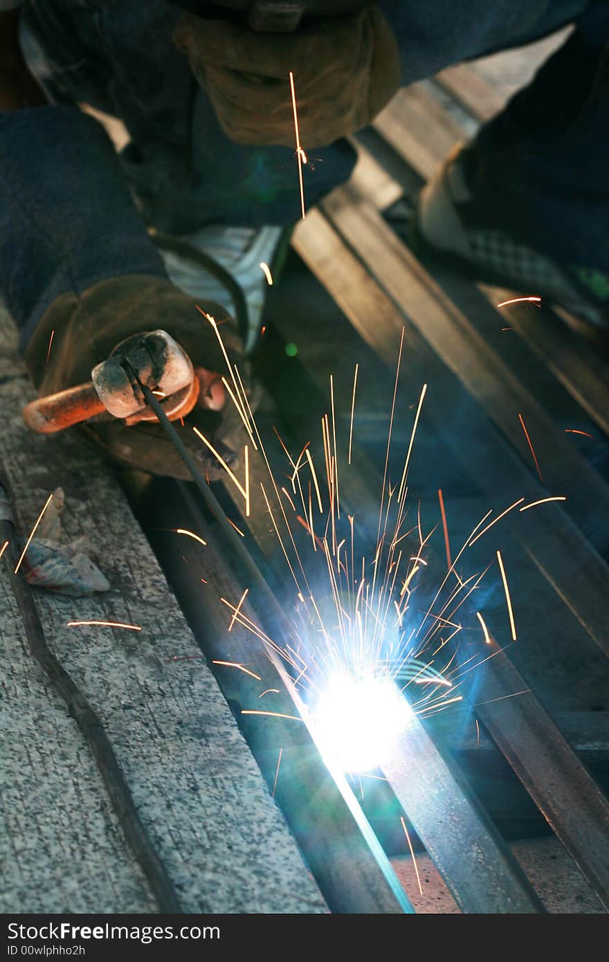 A welder working during night shift