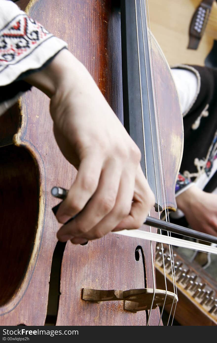 Close up of playing contrabass, focus on instrument