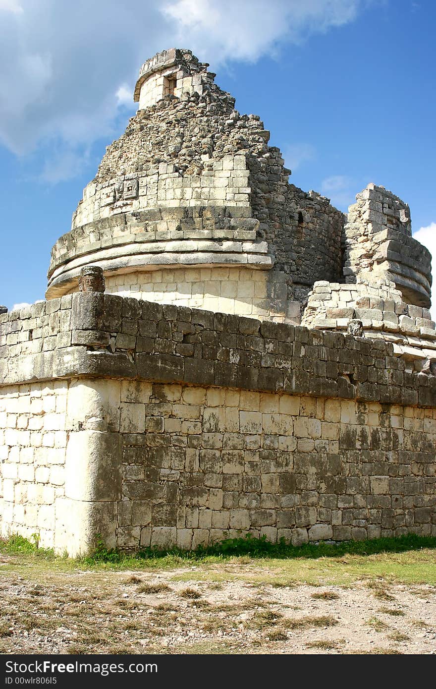 Antique maya observatory over blue sky and green grass. Antique maya observatory over blue sky and green grass