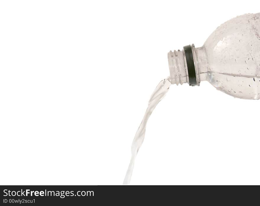 Water pouring from a plastic bottle isolated on white