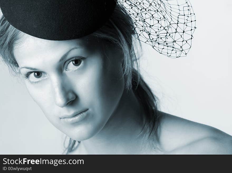 Retro styled portrait of pretty woman with veil