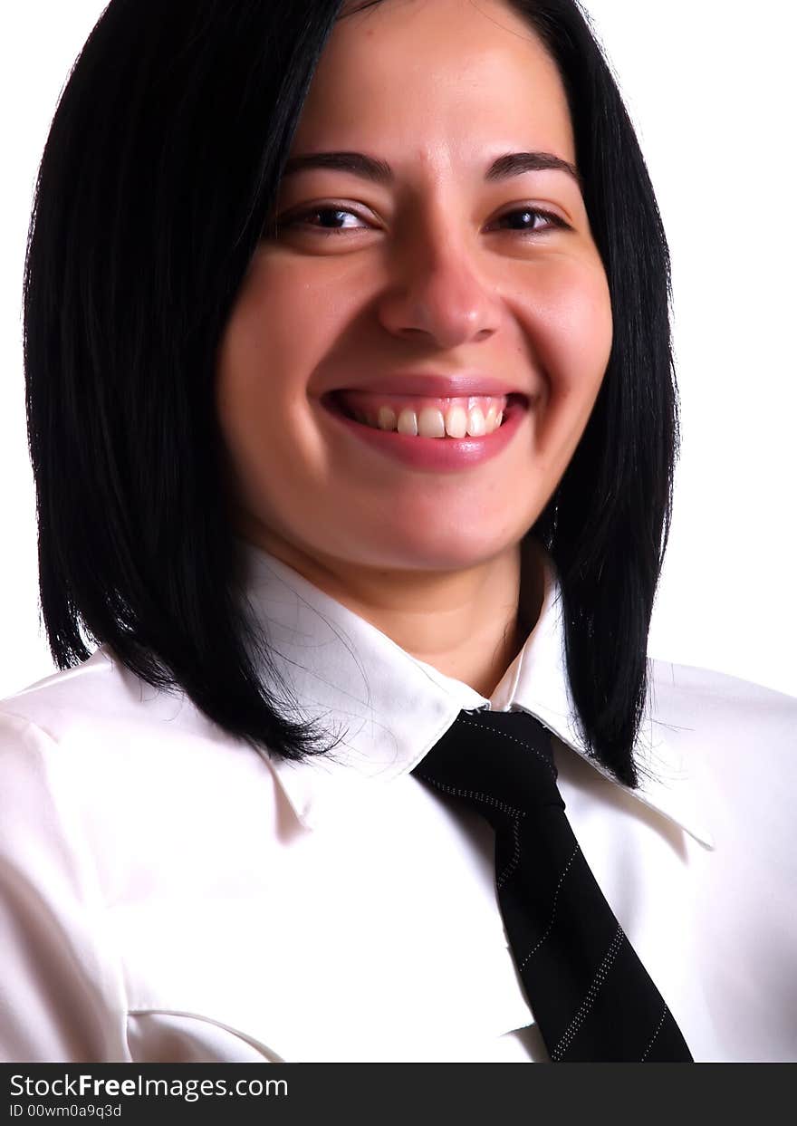 A portrait about a young successful pretty businesswoman with black hair who is happy and she wears a white shirt and a black tie. A portrait about a young successful pretty businesswoman with black hair who is happy and she wears a white shirt and a black tie