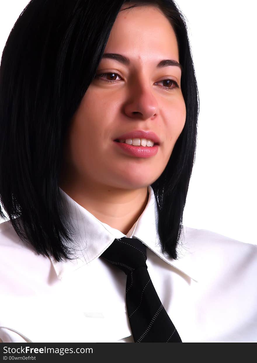 A portrait about a young pretty businesswoman with black hair who is discontent and she wears a white shirt and a black tie. A portrait about a young pretty businesswoman with black hair who is discontent and she wears a white shirt and a black tie