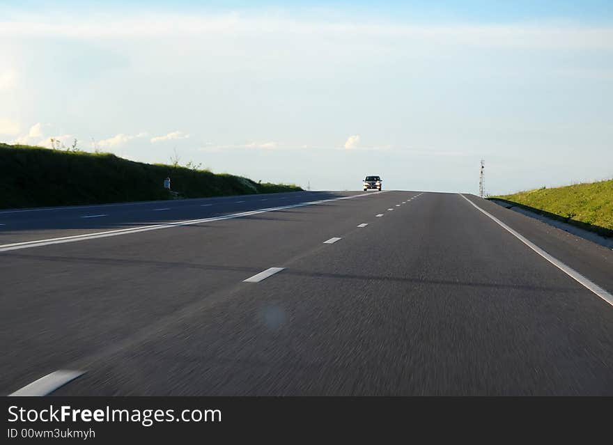 Car on highway in the light of sunset. Car on highway in the light of sunset