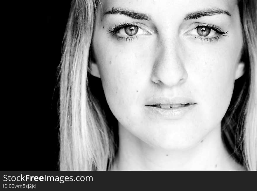 Young woman close portrait in black and white.