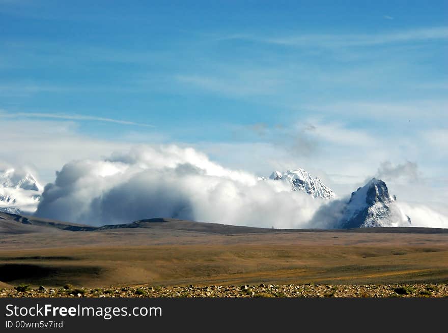 The Snow Mountain In Clouds