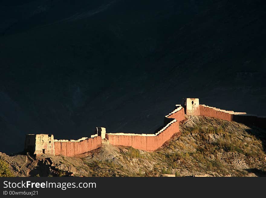 The ancient castle wall in sunset