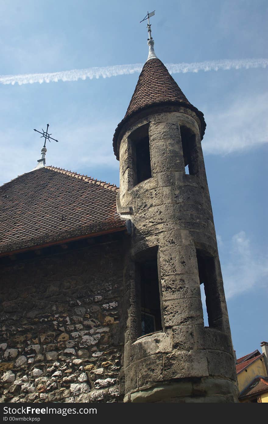 Tower of a medieval stone castle, in blue sky, vertical. Tower of a medieval stone castle, in blue sky, vertical.