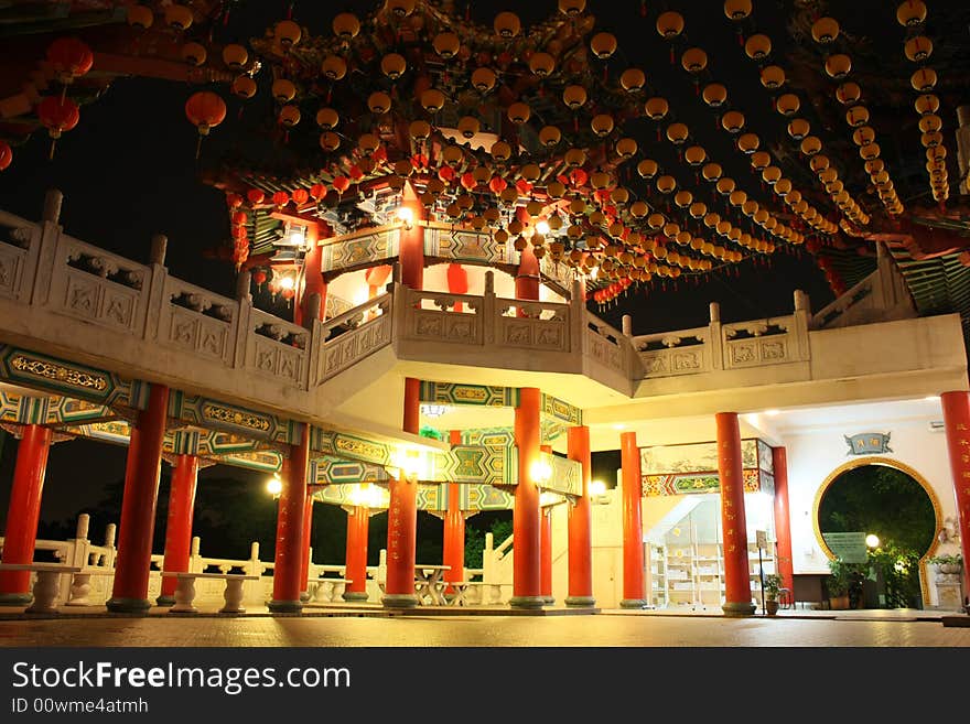 A chinese style pavilion decorated with yellow laterns. A chinese style pavilion decorated with yellow laterns