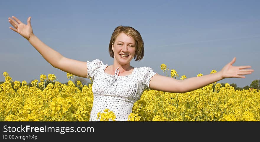 Beautiful woman in the summer field