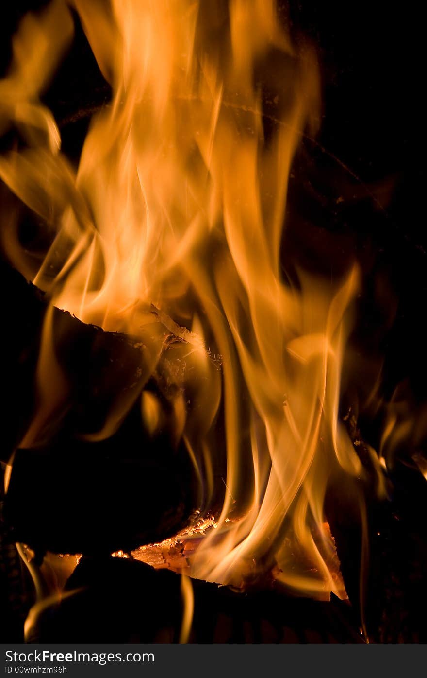 Abstract orange fire in the house fireplace. Abstract orange fire in the house fireplace