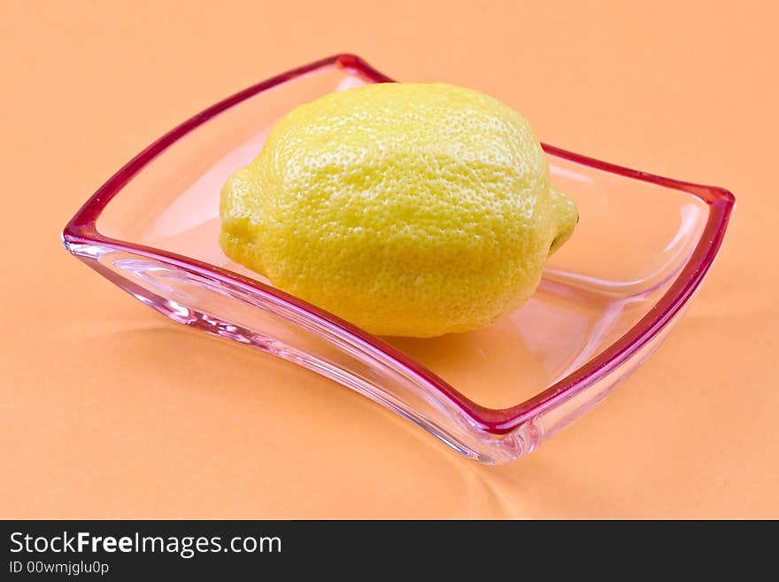 Lemon on the orange background