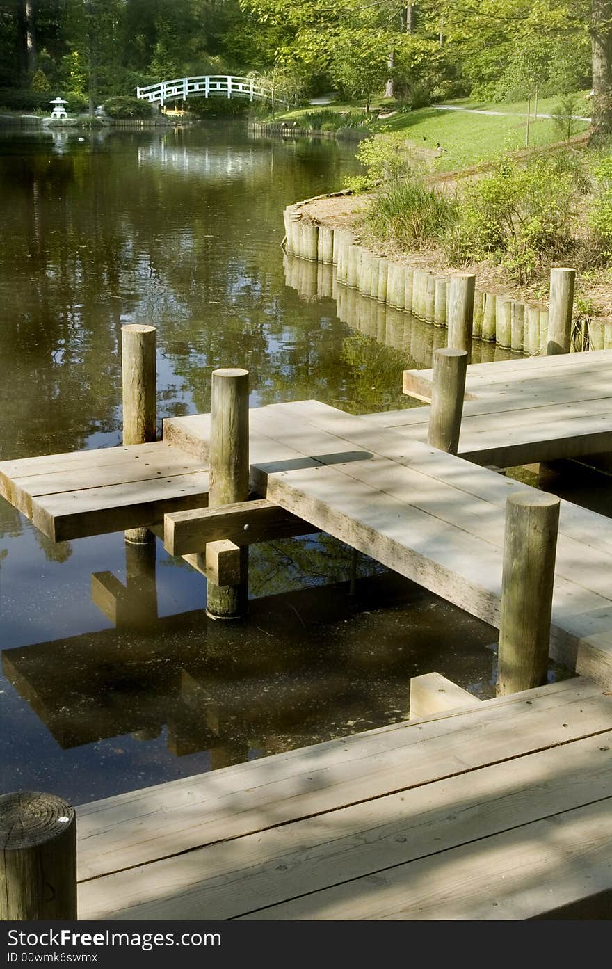 Japanese Zen Garden with arched bridge over koi pond. Japanese Zen Garden with arched bridge over koi pond