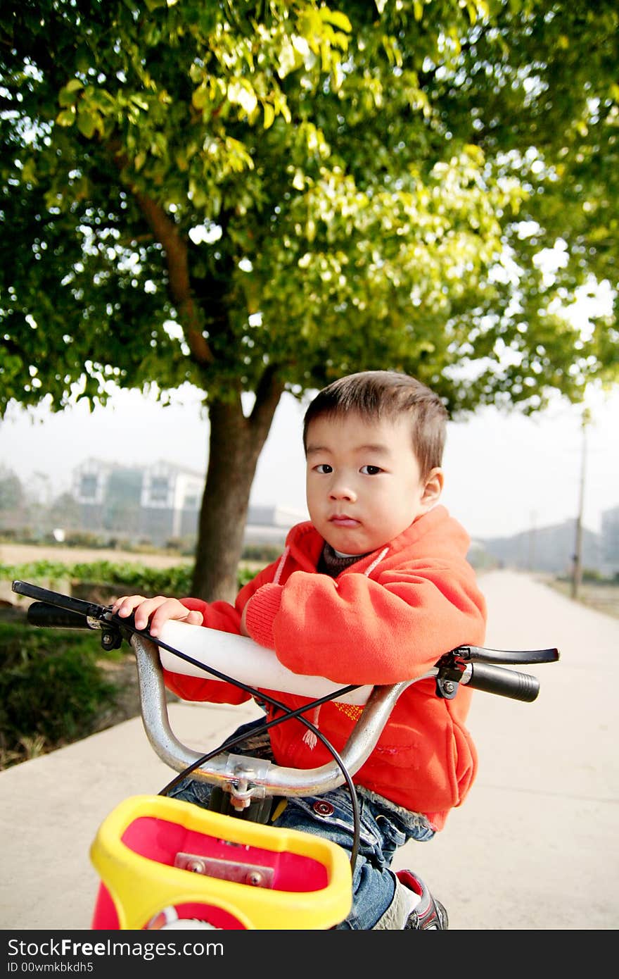 Asian boy on his bike