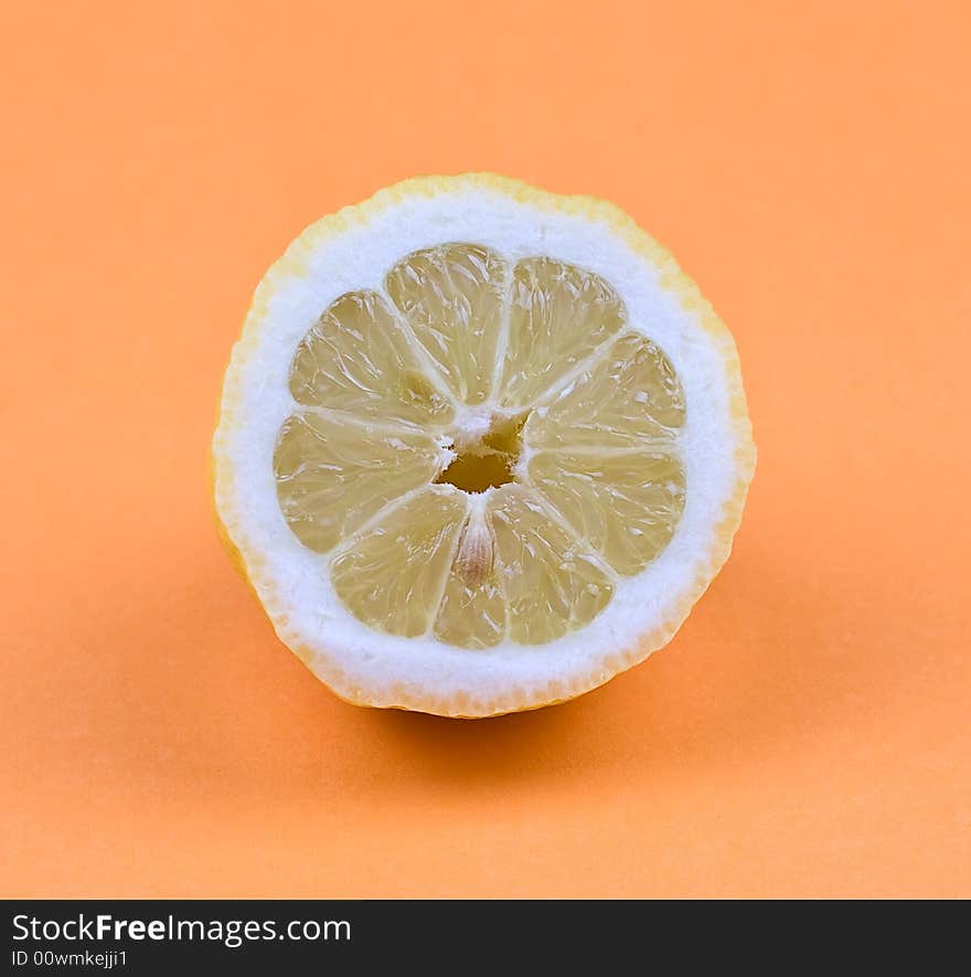 Lemon on the orange background