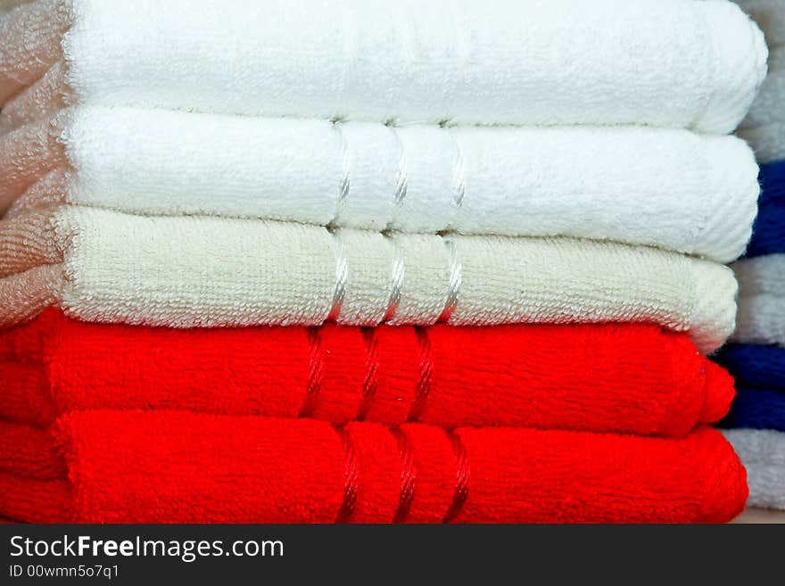 Stack of dry soft towels red and white