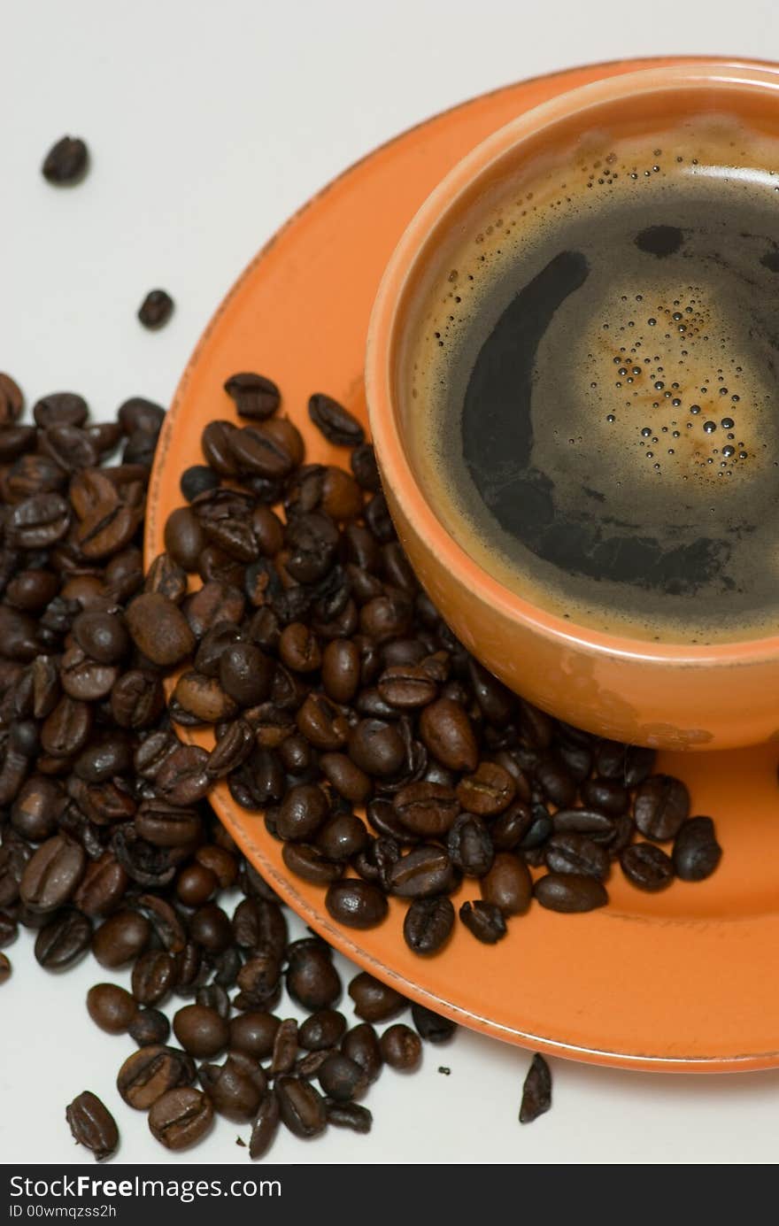 Still life with mug with coffee and coffee beans