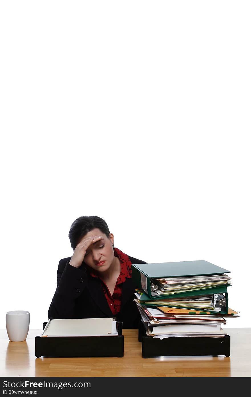 An isolated shot, on white, of a businesswoman, with her eyes closed, touching her head as if she has a migraine headache. An isolated shot, on white, of a businesswoman, with her eyes closed, touching her head as if she has a migraine headache.