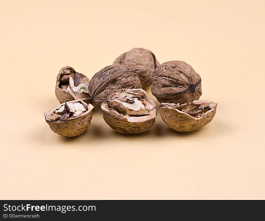 Walnuts on the orange background