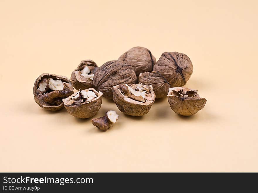 Walnuts on the orange background