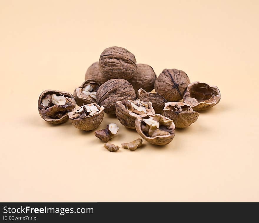 Walnuts on the orange background