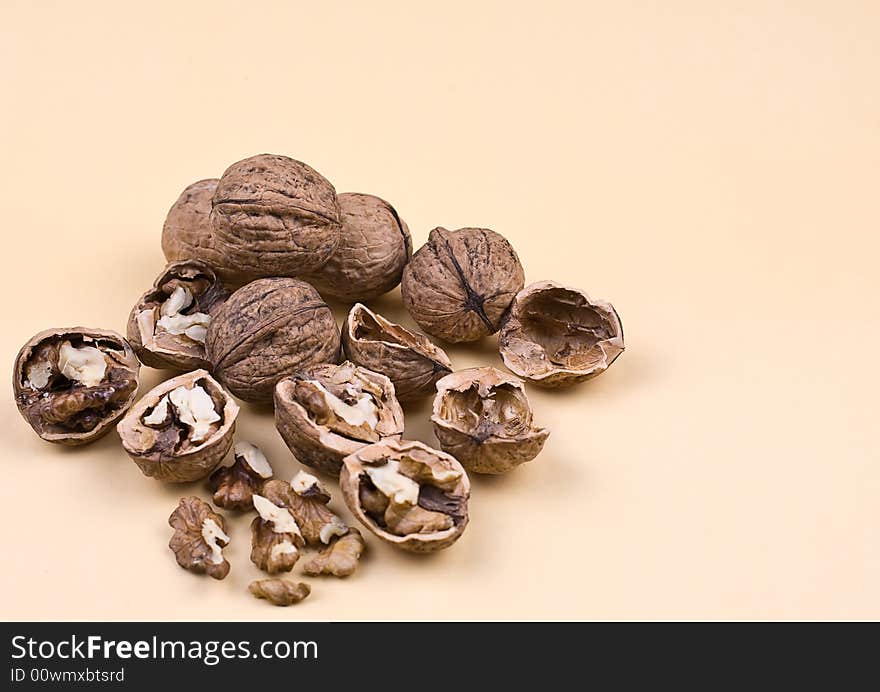 Walnuts on the orange background