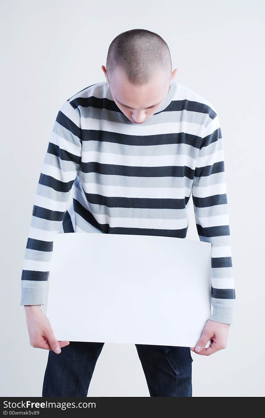 Man takes placard at black background