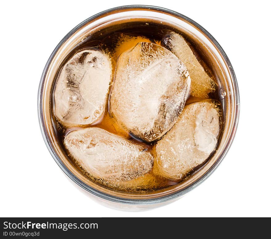 Cold fizzy cola with ice in a glass. Close up.